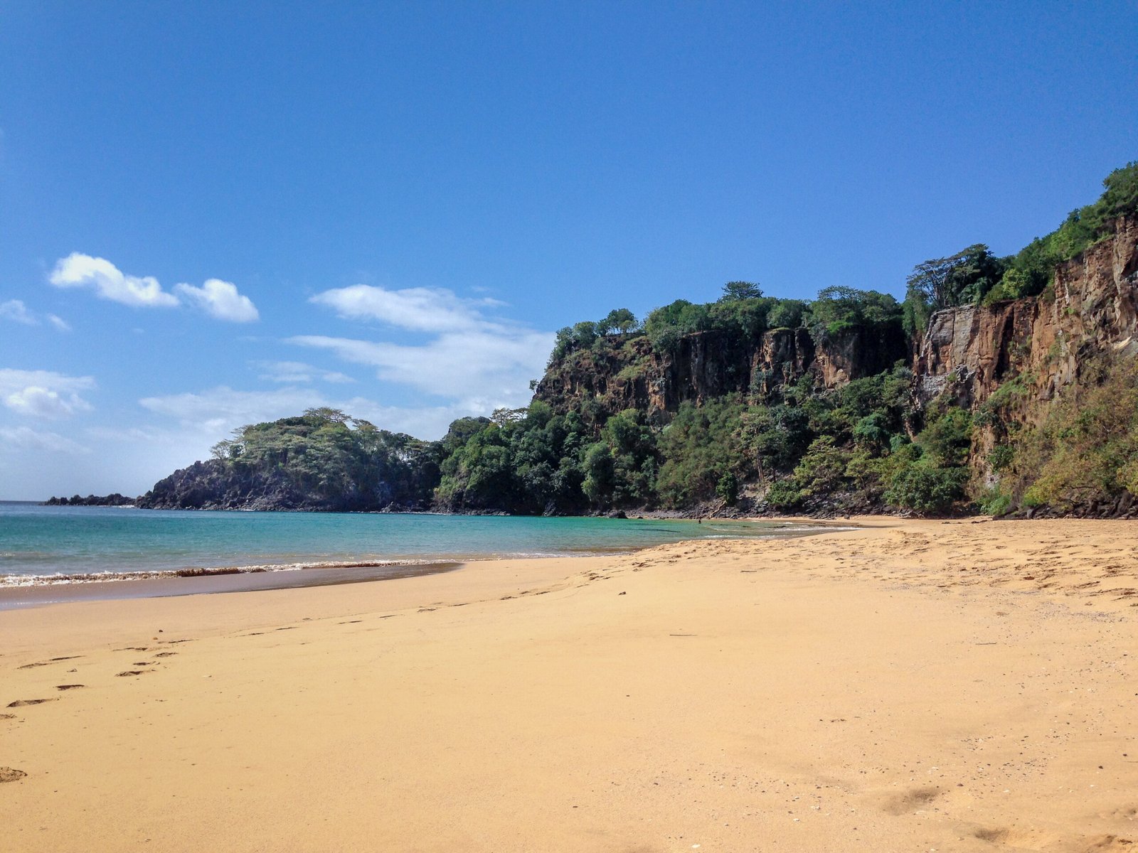 Ocean, sandy beach and volcanic island landscape at Fernando de Noronha, Brazil