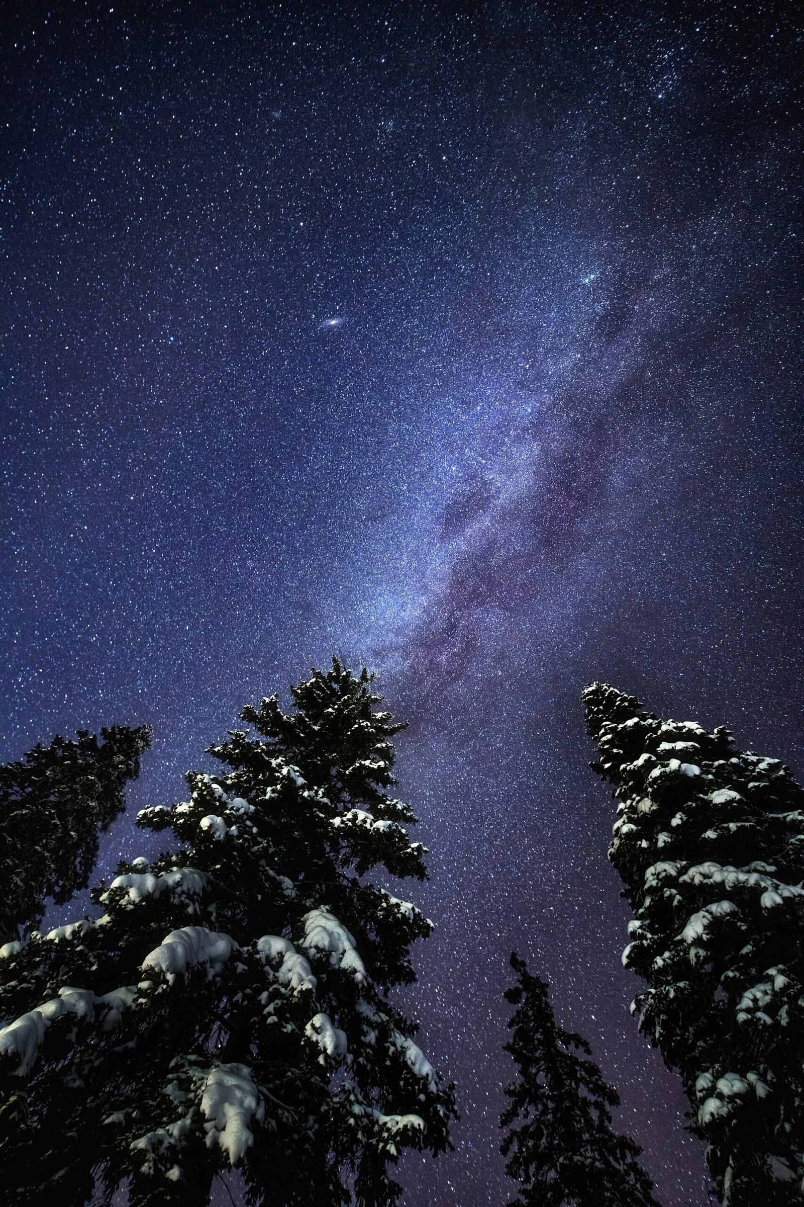 Milky Way rising above a dark mountain landscape in Taganay National Park