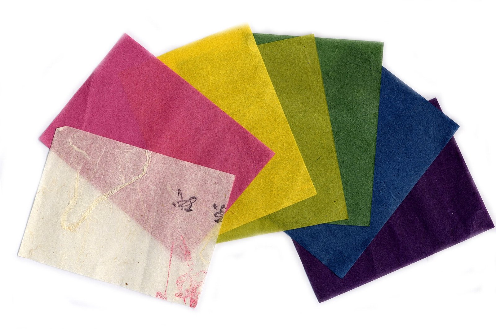 Sheets of coloured Sugihara washi paper arranged on a white background