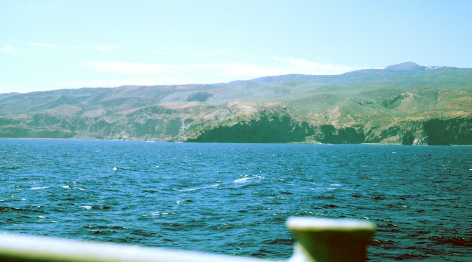 Rocky volcanic coastline of Socorro Island rising above the Pacific
